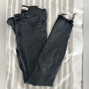 Madewell Black midrise skinny jeans.  Distressed bottoms.  Size 26